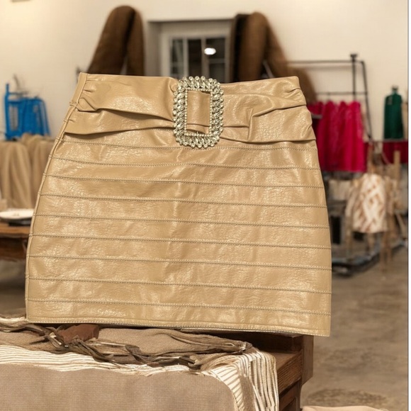 the sang Dresses & Skirts - The Sang Tan Faux Leather Mini Skirt S –‎ Rhinestone Buckle, Bandage Style